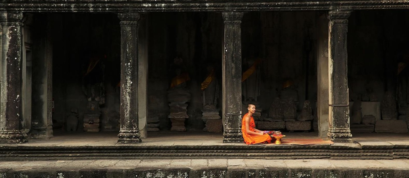 Monk outside temple near Amansara in the Siem Reap region of Cambodia