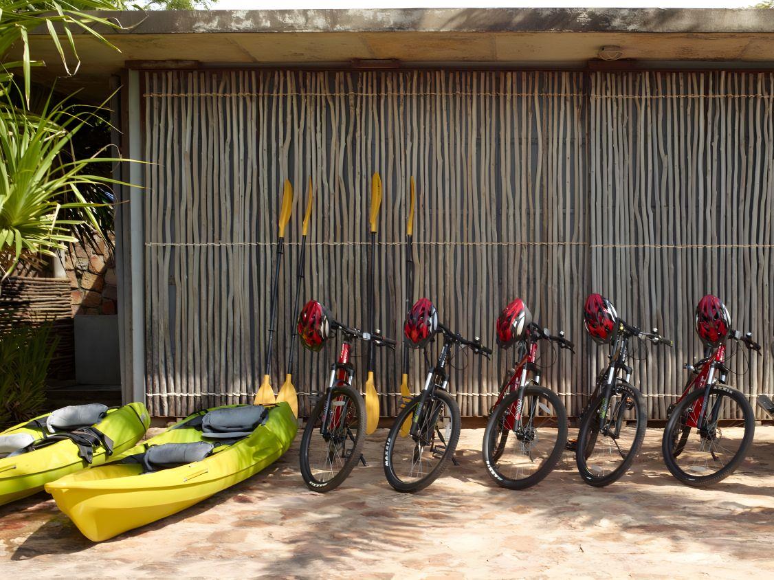 Beach club exterior with bicycles and water sports gear to rent at Knai Bang Chatt resort in Cambodia