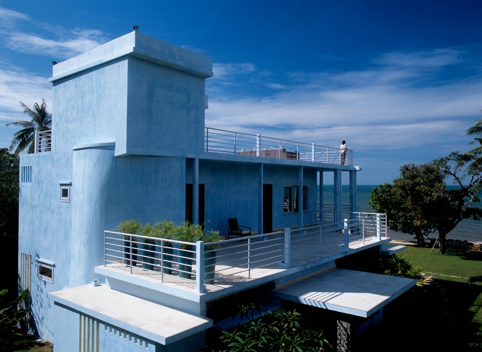 Exterior view of a blue guest villa at Knai Bang Chatt resort in Cambodia