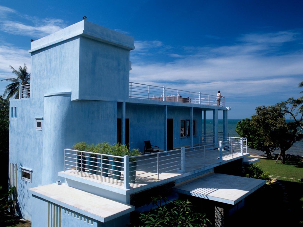 Exterior view of a blue guest villa at Knai Bang Chatt resort in Cambodia