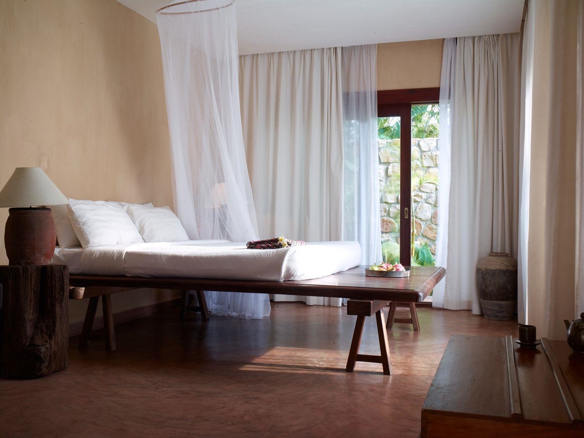 Guest suite bedroom at Knai Bang Chatt resort in Cambodia