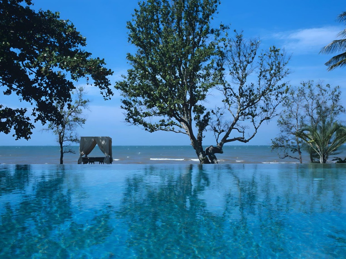 Infinity pool with beach views at Knai Bang Chatt resort in Cambodia
