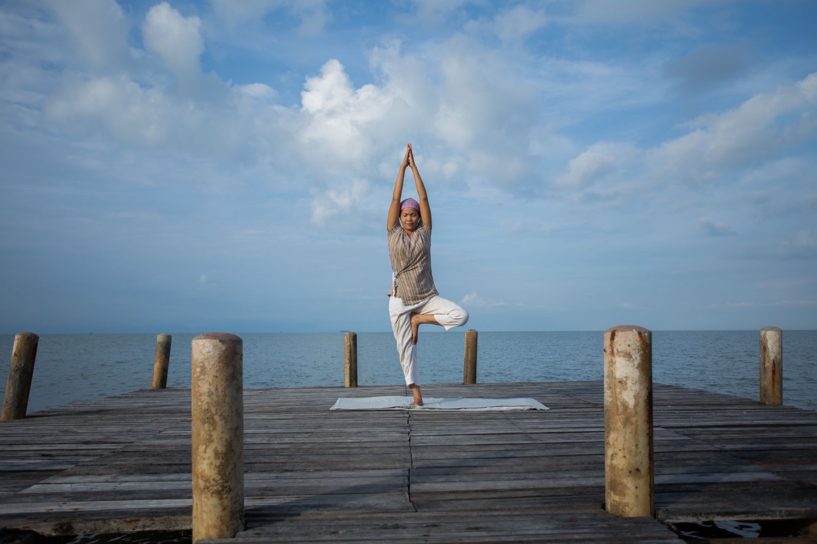 A yoga session on the beachfront pavilion at Knai Bang Chatt resort in Cambodia