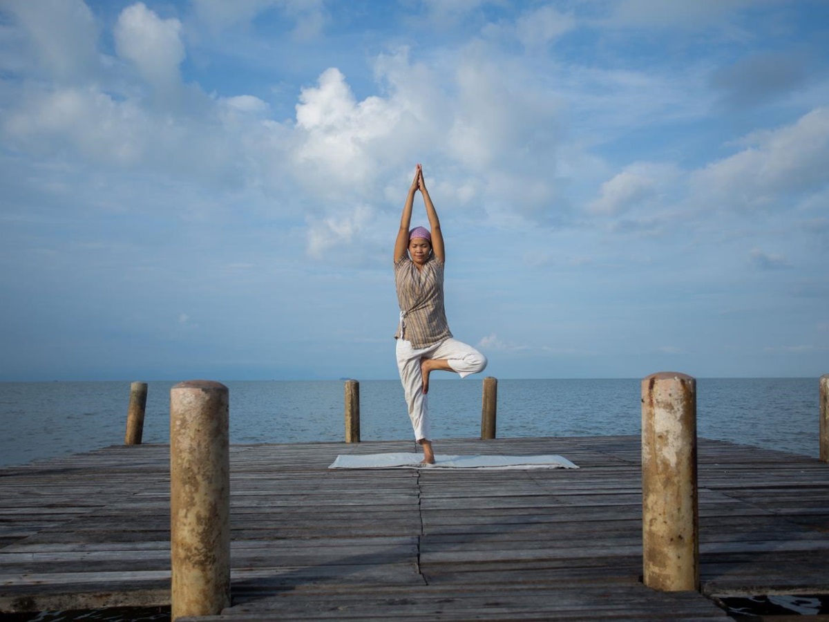 A yoga session on the beachfront pavilion at Knai Bang Chatt resort in Cambodia
