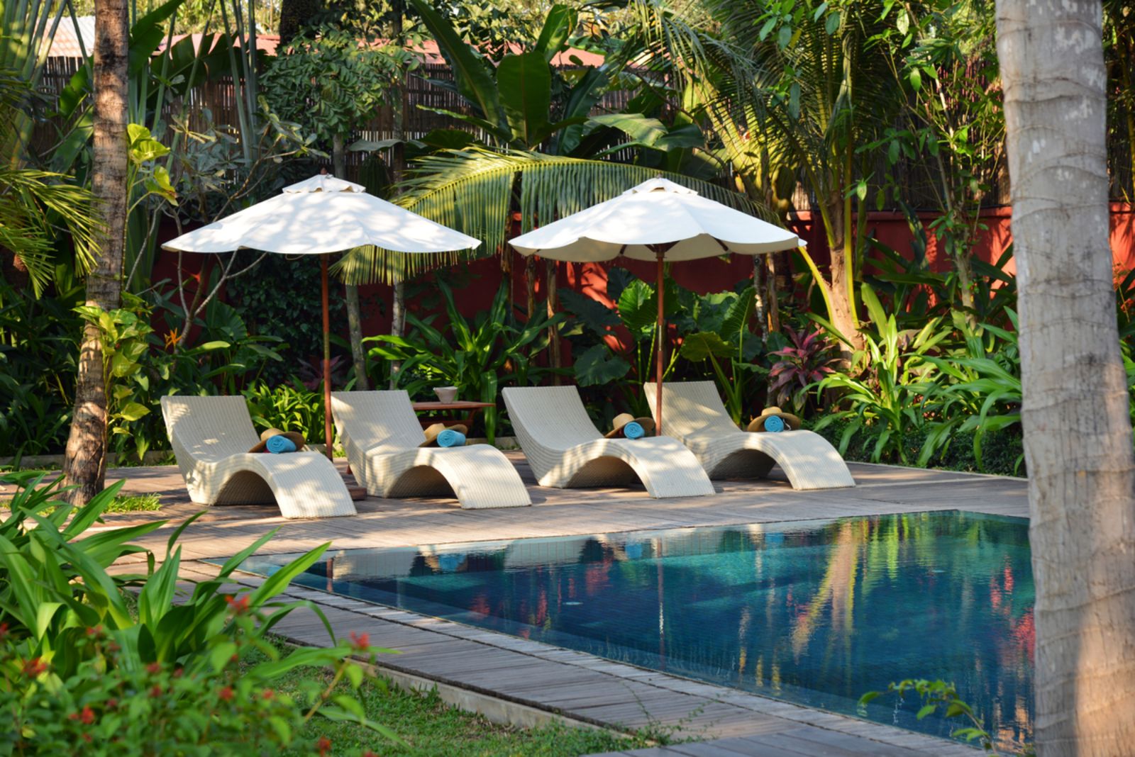 Pool loungers by the swimming pool at Maison Polanka in Cambodia's Siem Reap