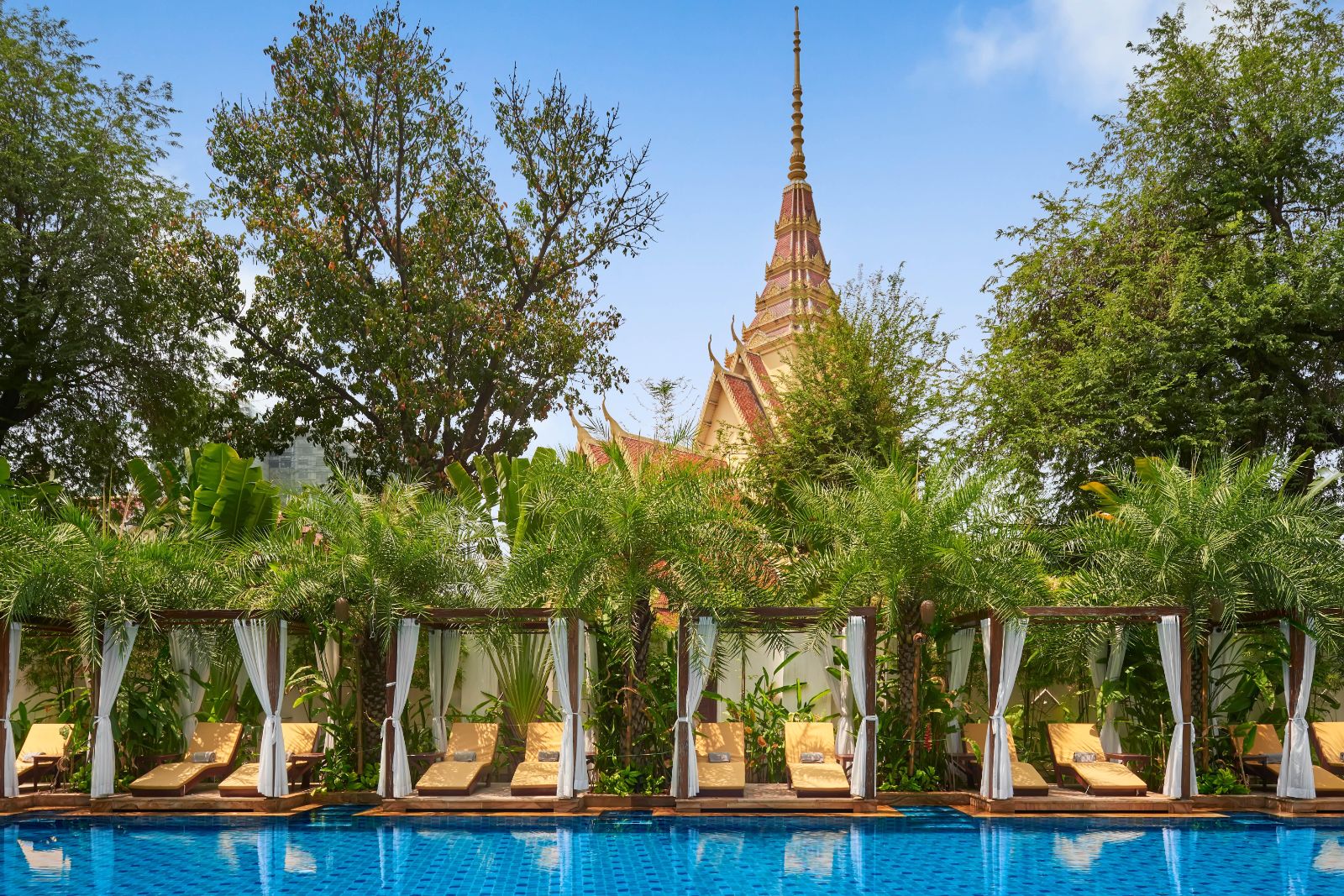 Sunbeds by the poolside at Palace Gate Hotel in Phnom Penh, Cambodia