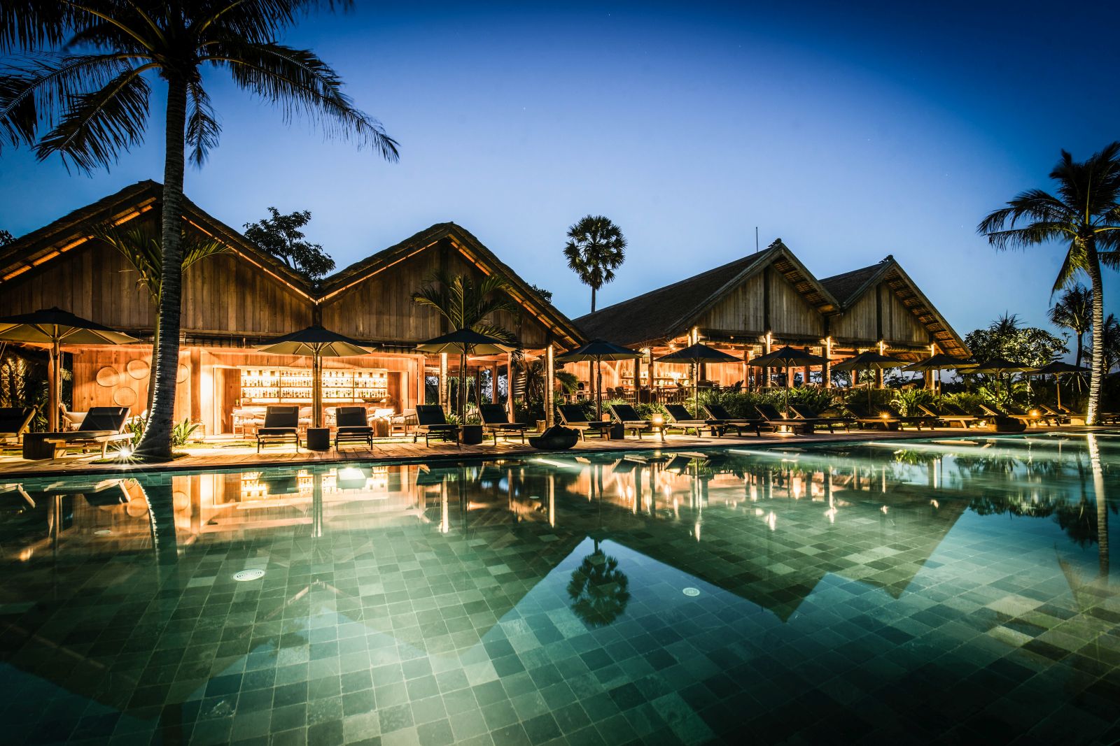 Evening view of the swimming pool at Phum Baitang hotel in Cambodia