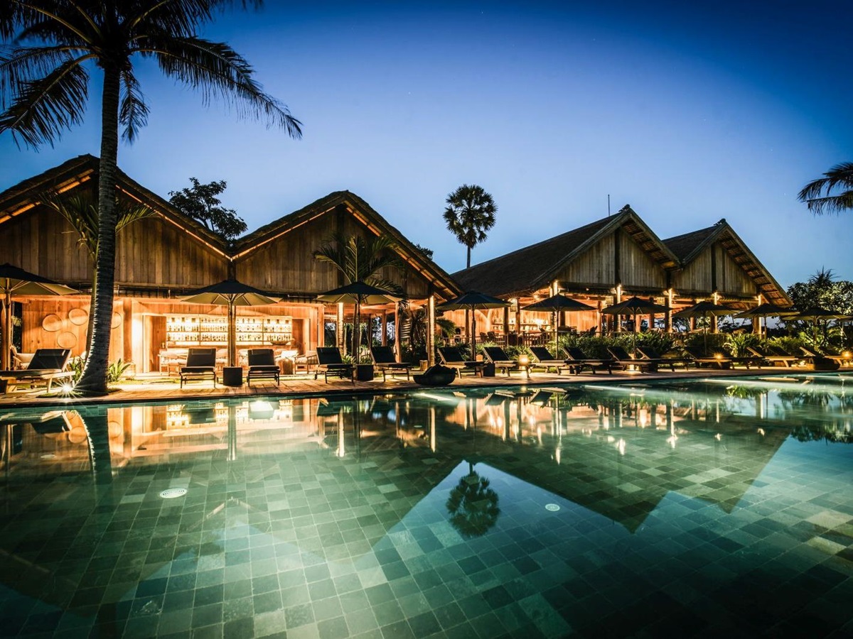 Evening view of the swimming pool at Phum Baitang hotel in Cambodia