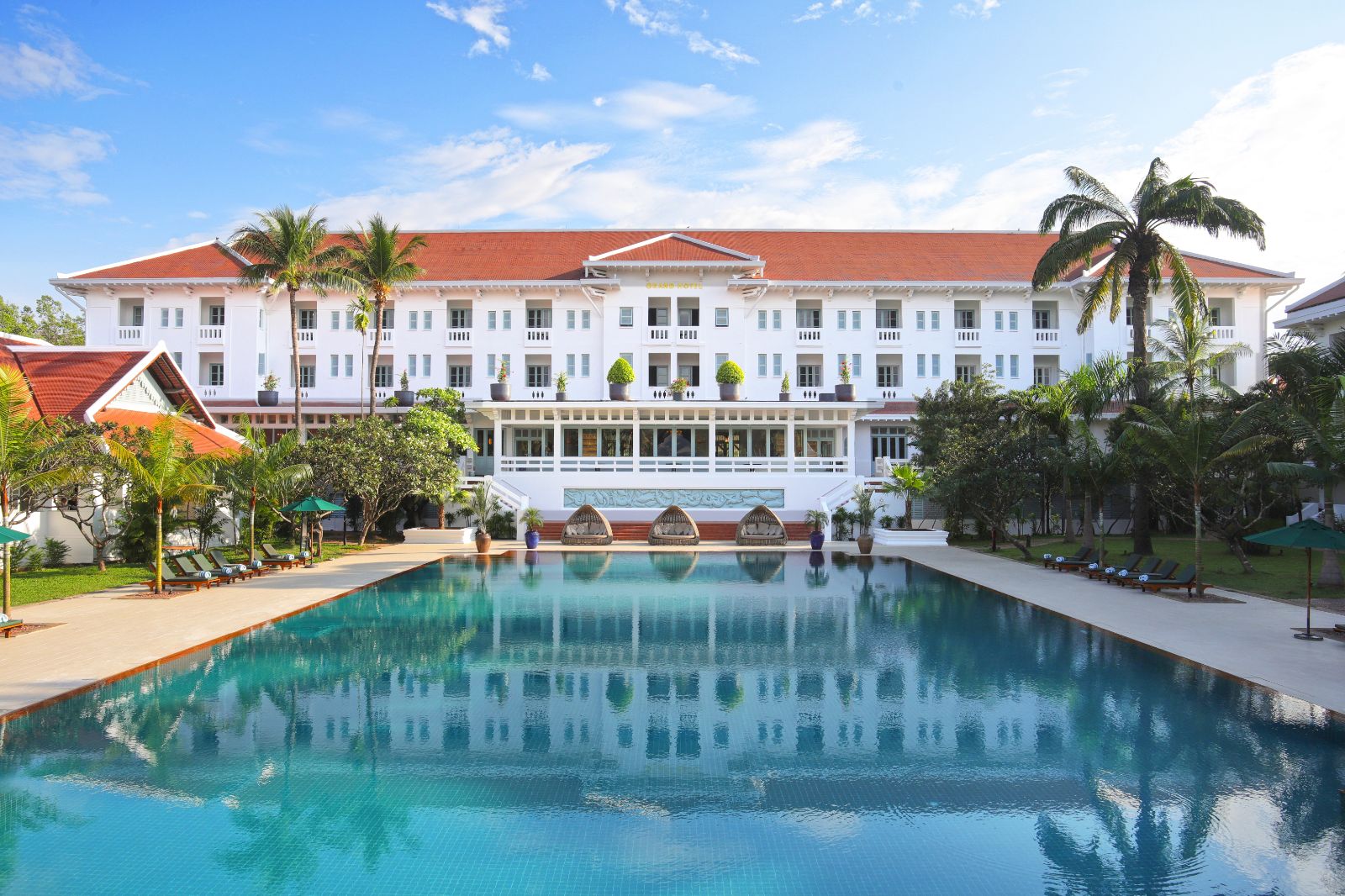 Pool and hotel exterior at Raffles Grand Hotel d'Angkor in Siem Reap, Cambodia