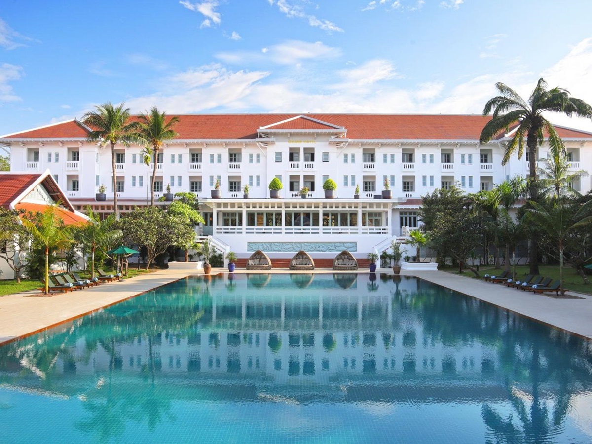 Pool and hotel exterior at Raffles Grand Hotel d'Angkor in Siem Reap, Cambodia