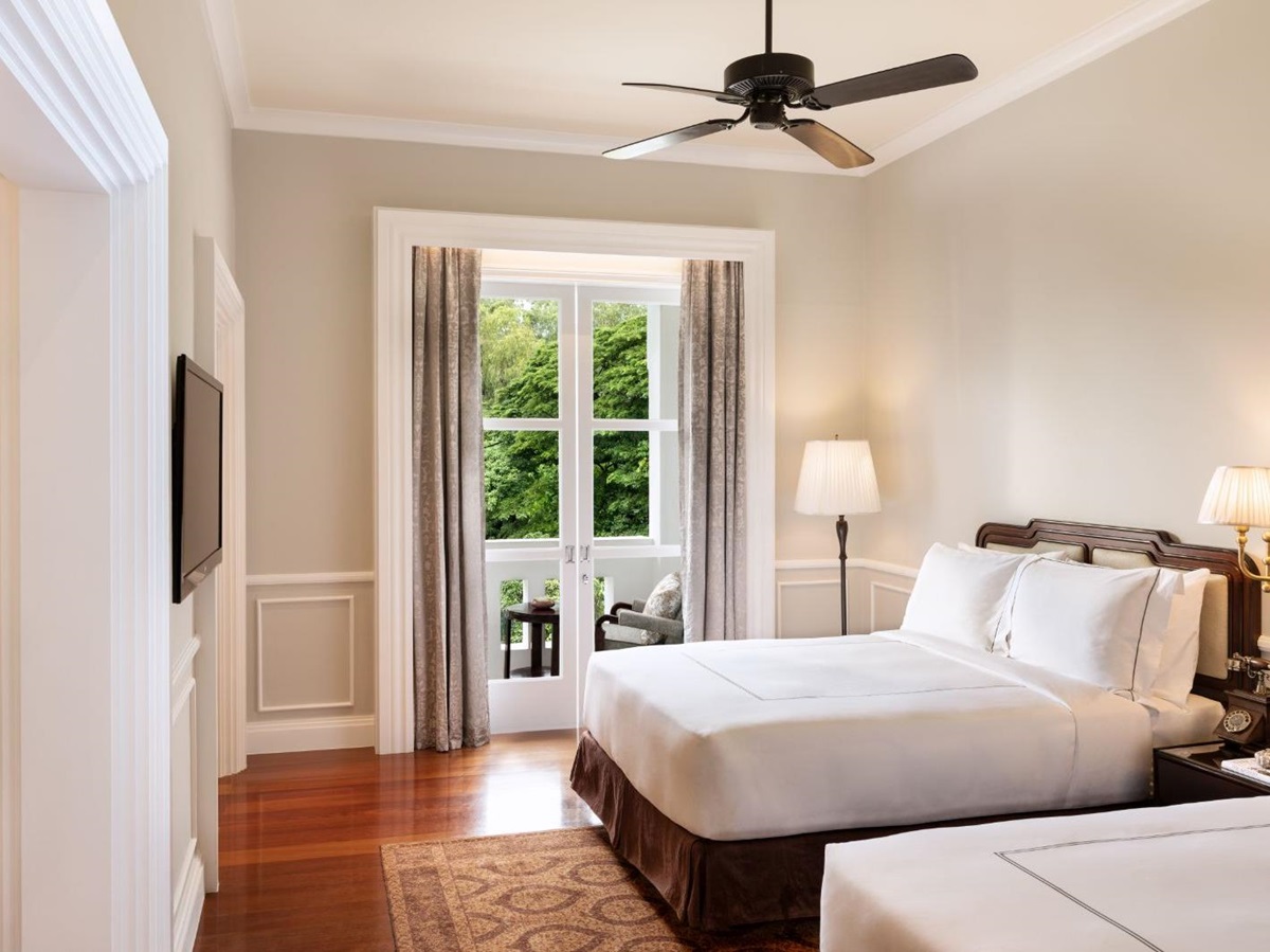Twin guest suite bedroom at Raffles Grand Hotel d'Angkor in Siem Reap, Cambodia