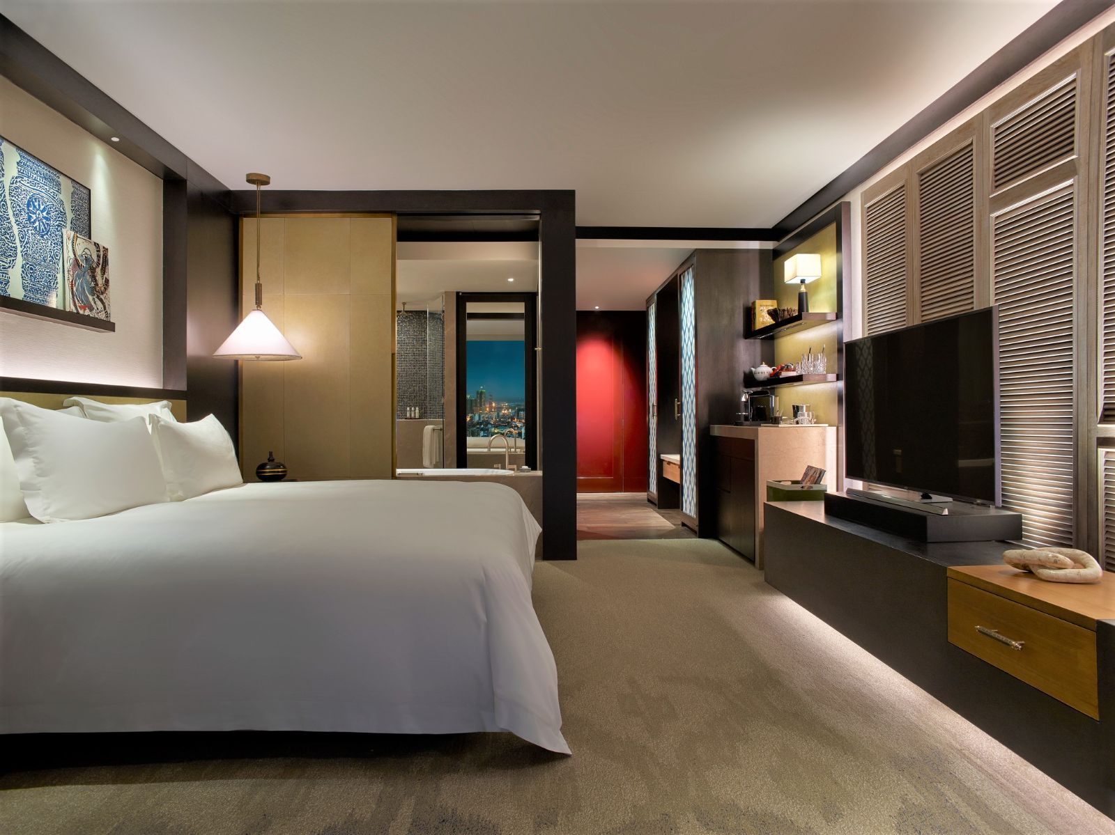 Executive guest suite bedroom at Rosewood Phnom Penh in Cambodia