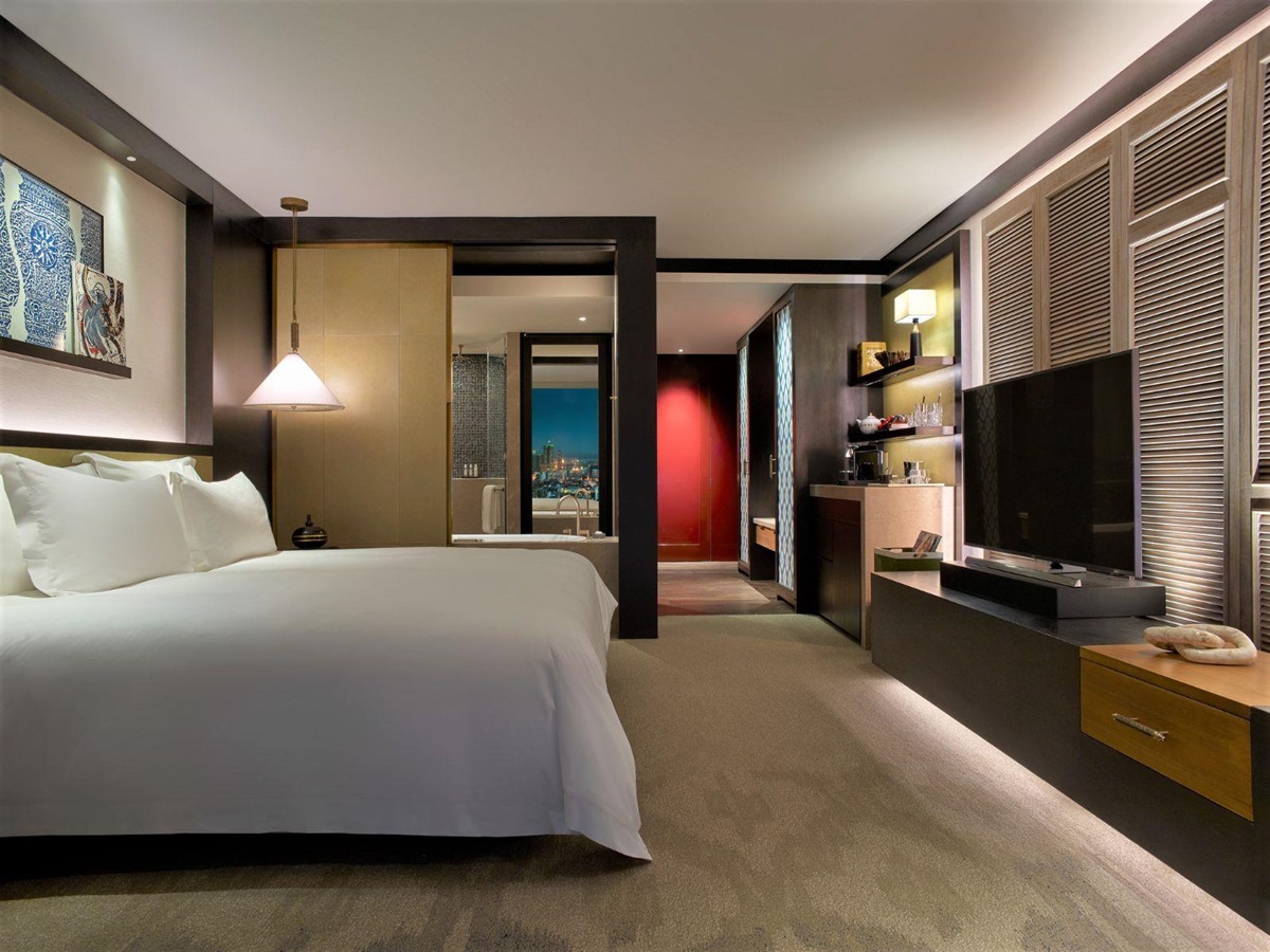Executive guest suite bedroom at Rosewood Phnom Penh in Cambodia