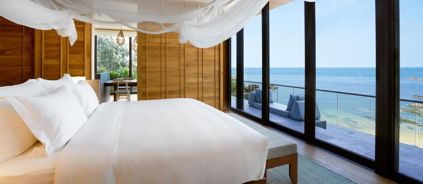 Bedroom with sea view in The Beach Retreat at Luxury Resort Six Senses Krabey