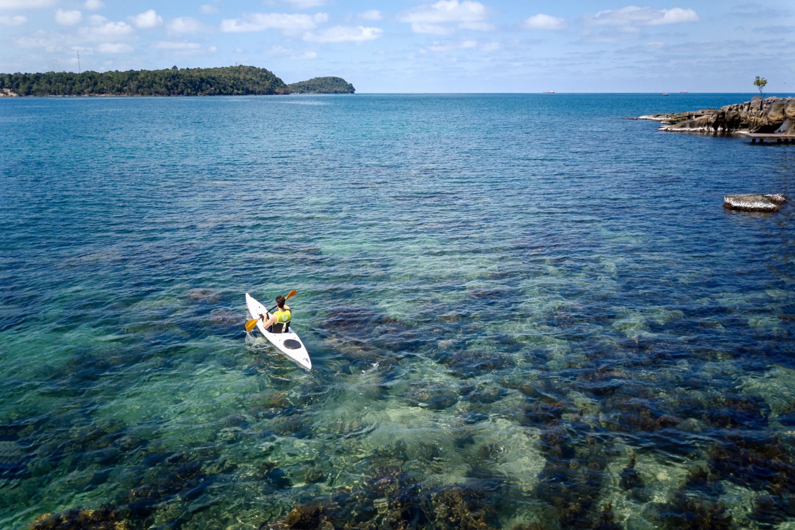 Someone kayaking in the sea at Luxury Resort Six Senses Krabey
