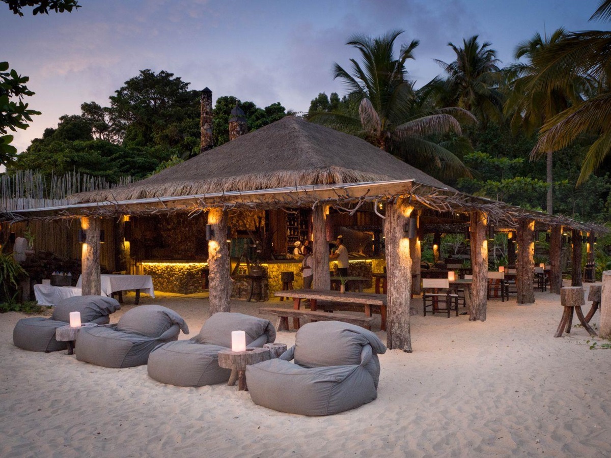 Beanbags on beach during sunset at luxury resort Song Saa