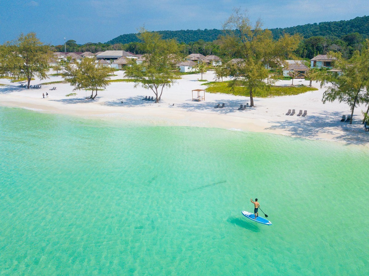 paddle boarding on the grounds of the Royal Sands Resort in Koh Rong, Cambodia
