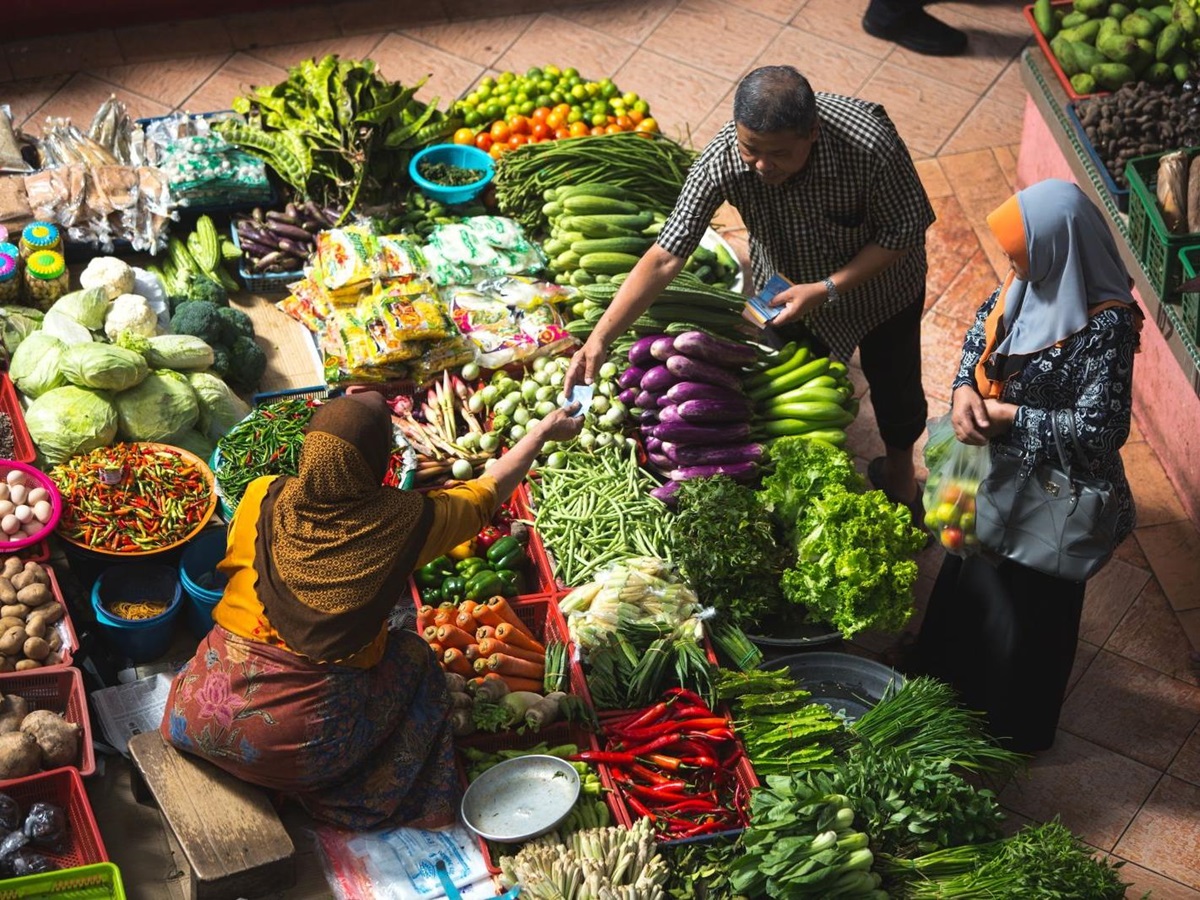 A woman selling food at a Cambodian food market