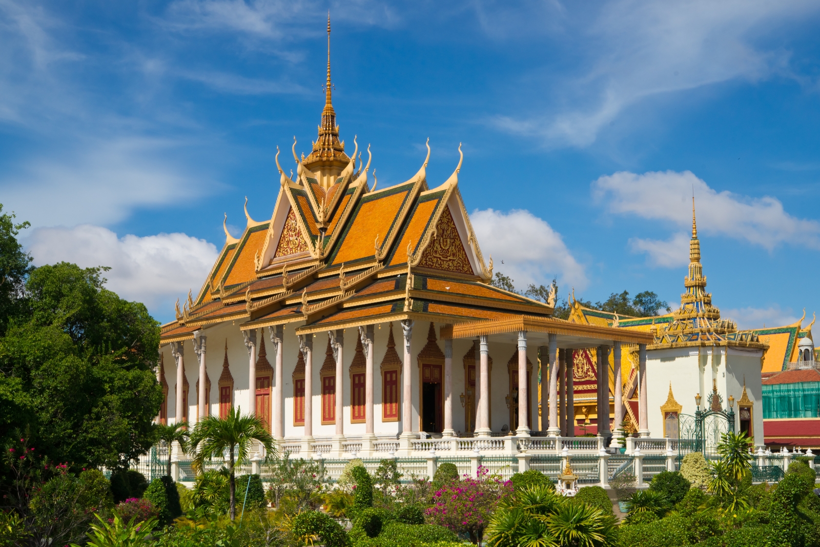 Large gold roofed temple with white columns