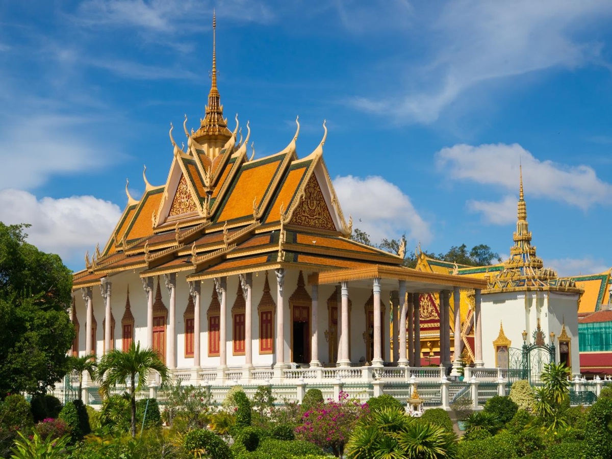 Large gold roofed temple with white columns