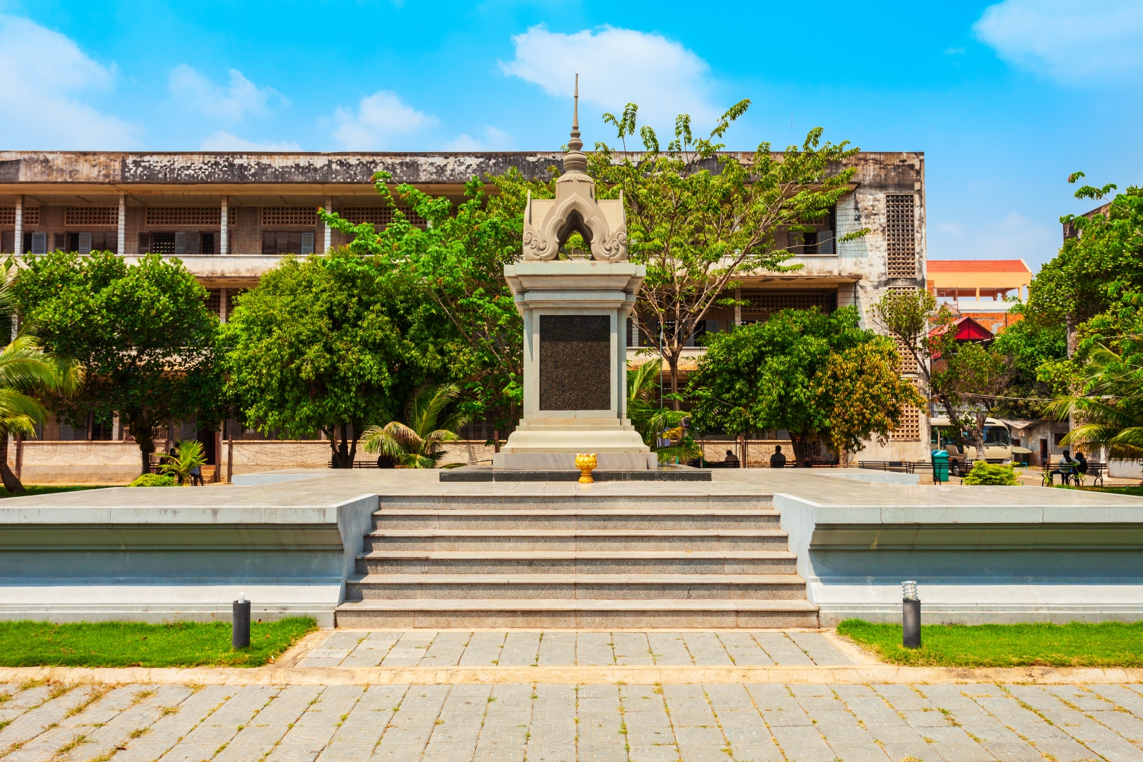 Tuol Sleng museum with stupa and foliage