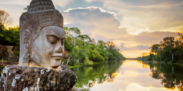 Stone face Asura on causeway, South Gate of Angkor Thom, Siem Reap
