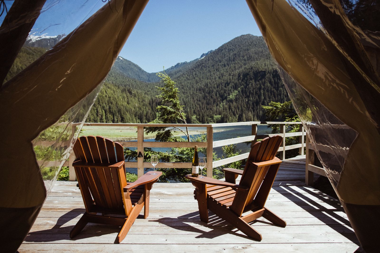 Waterfront tent terrace and seating at Clayoquot Wilderness Resort in Vancouver, Canada