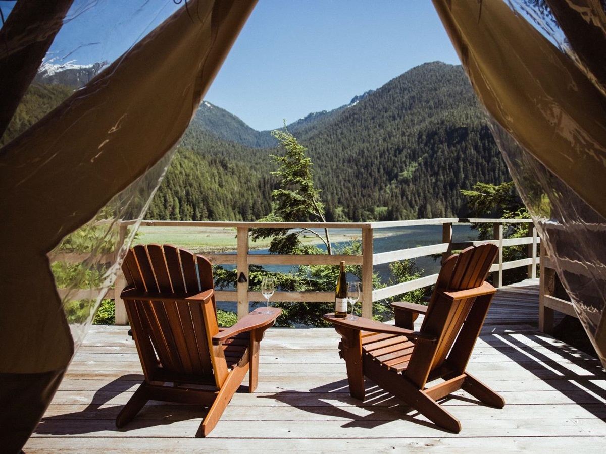 Waterfront tent terrace and seating at Clayoquot Wilderness Resort in Vancouver, Canada