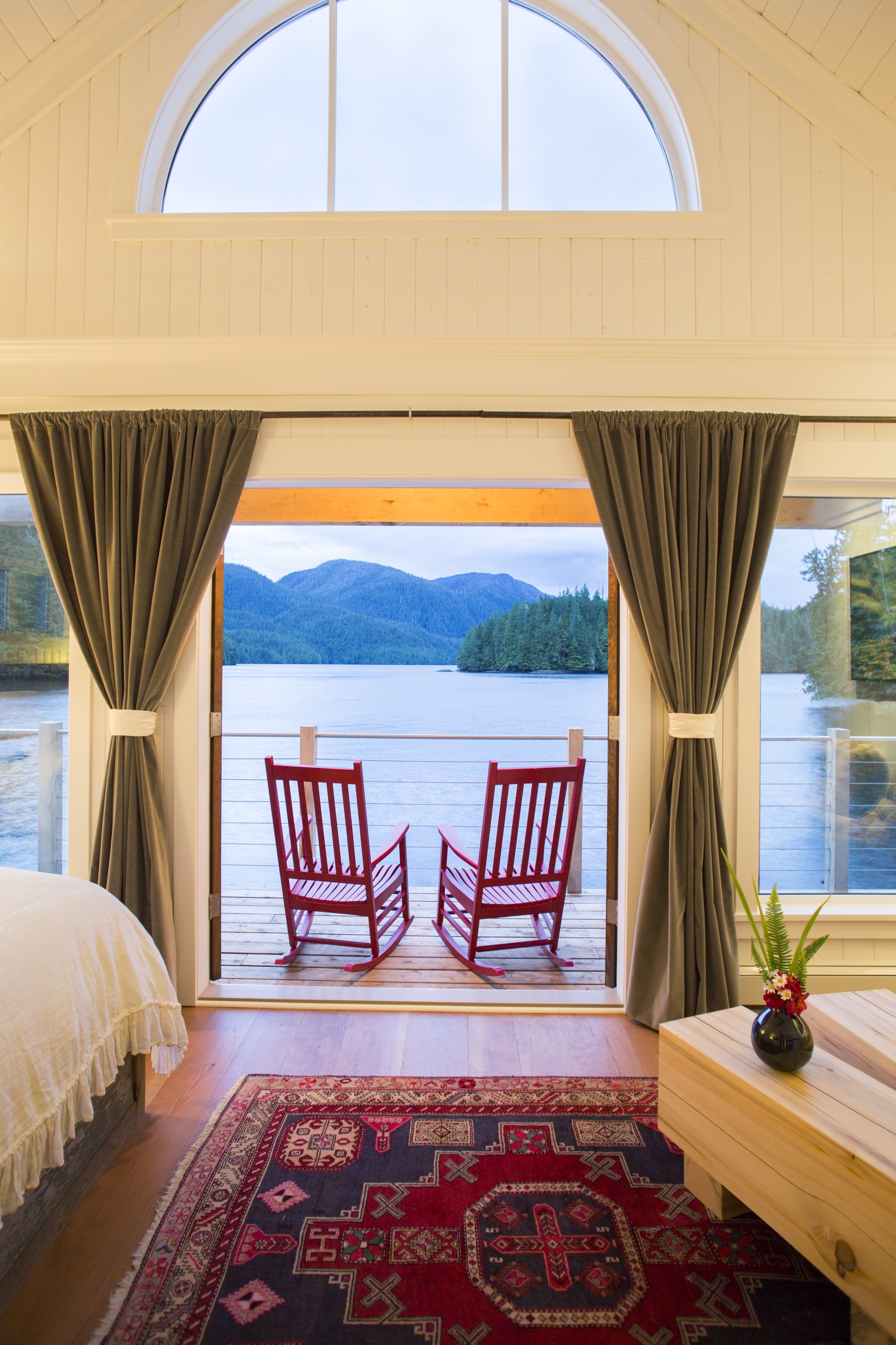 Two chairs overlooking the bay in a cabin at luxury hotel Nimmo Bay in Canada