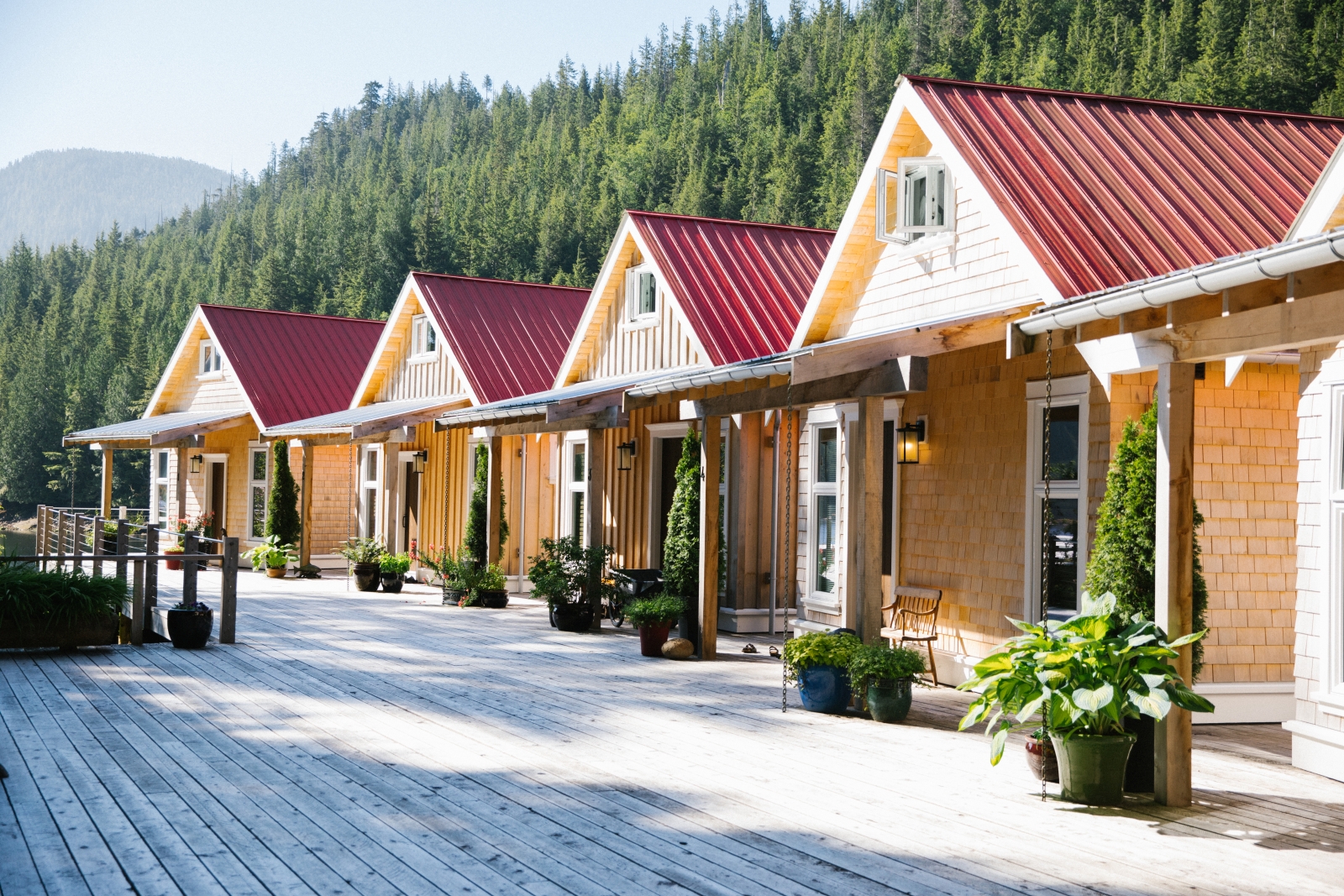 Four cabins in the daylight with patios