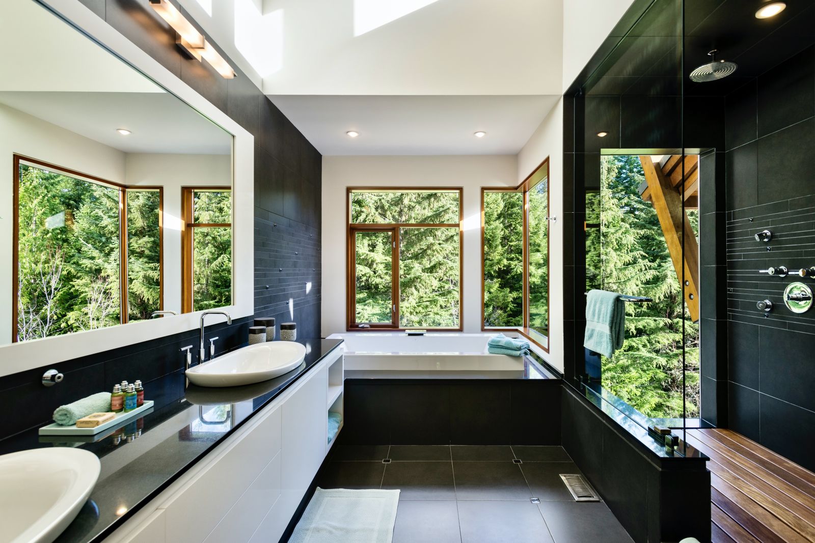 black marble bathroom with tub at luxury private home The Belmont Estate in Whistler, Canada
