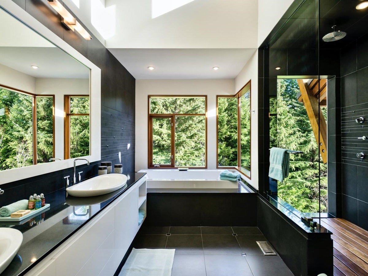 black marble bathroom with tub at luxury private home The Belmont Estate in Whistler, Canada