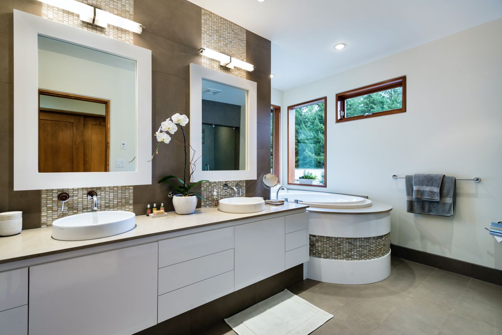Luxurious bathroom with tub and double vanity at luxury private home The Belmont Estate in Whistler, Canada