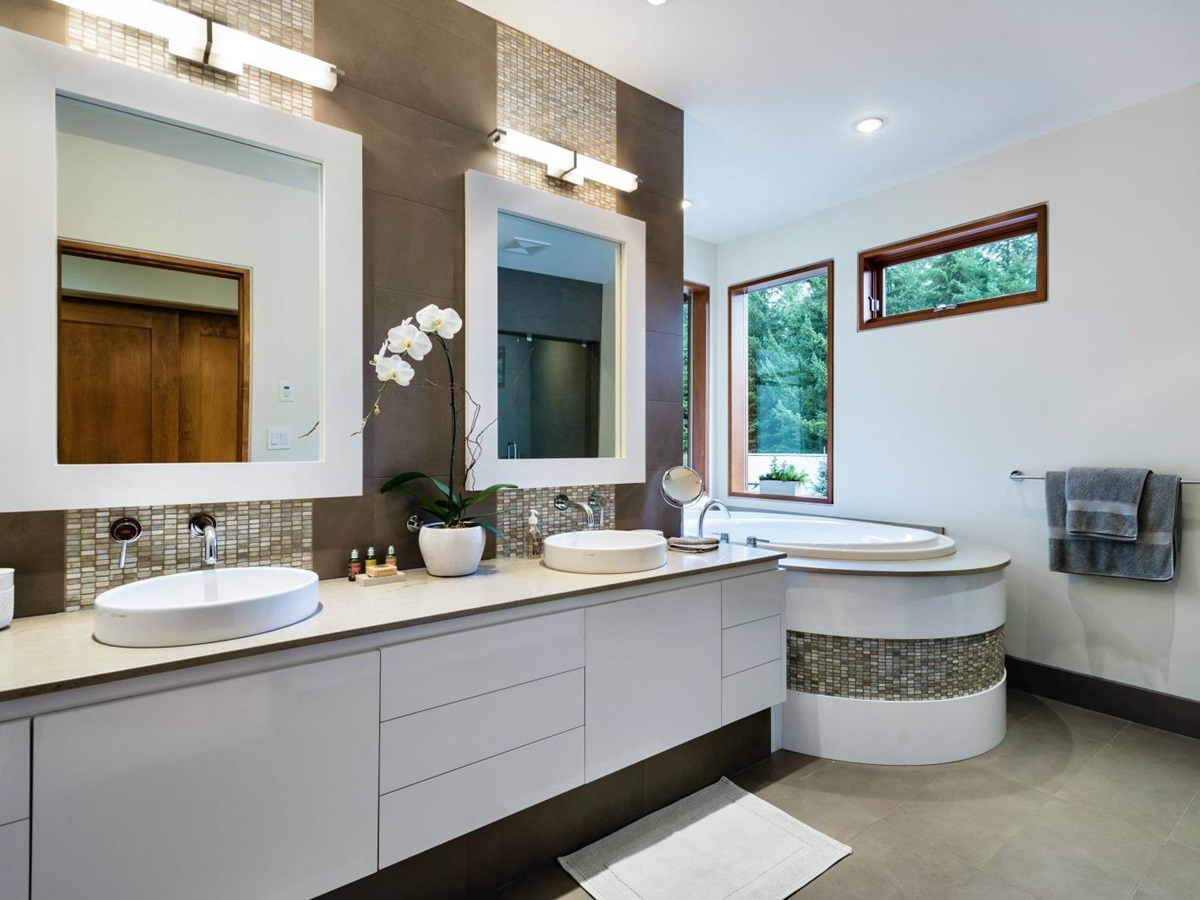 Luxurious bathroom with tub and double vanity at luxury private home The Belmont Estate in Whistler, Canada