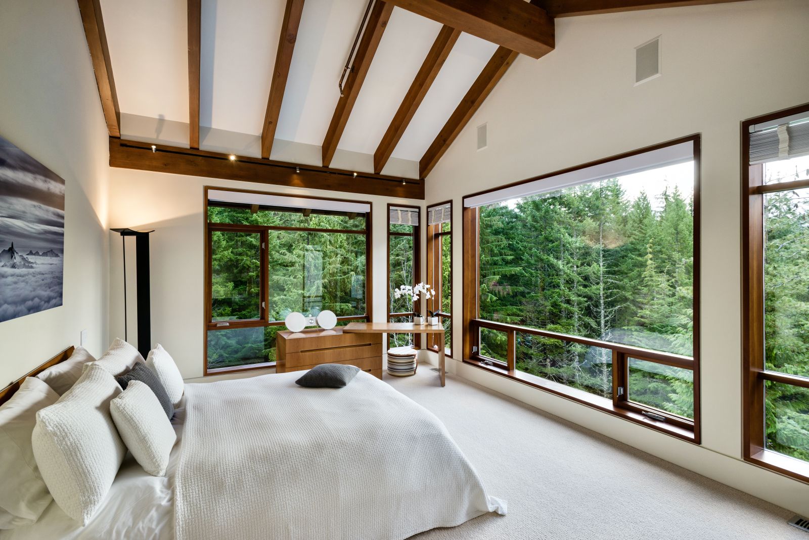 Double Bedroom with large windows overlooking the forest at luxury private home The Belmont Estate in Whistler, Canada