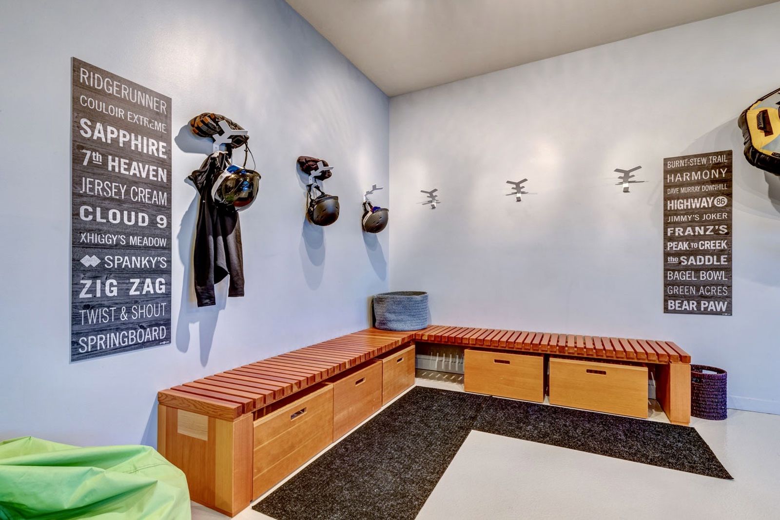 Cloakroom with storage for shoes and equipment and ample space on the walls for coats and jackets at luxury private home The Belmont Estate in Whistler, Canada 