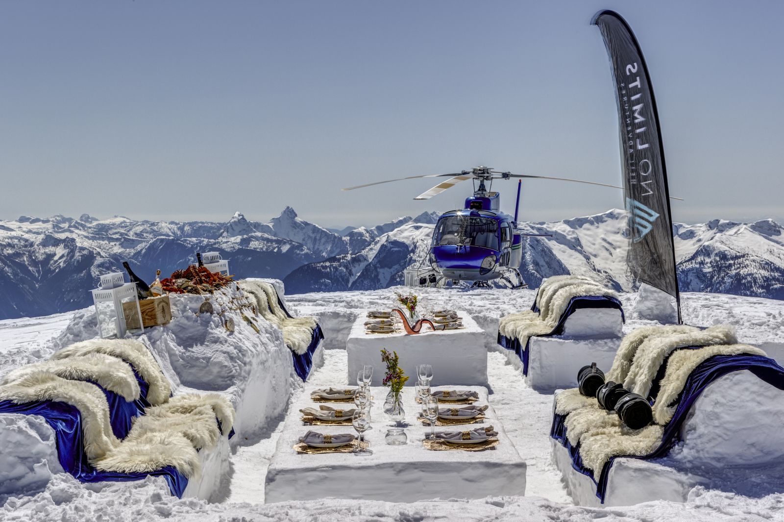 Meal in the snow on a helicopter tour at luxury private home The Belmont Estate in Whistler, Canada