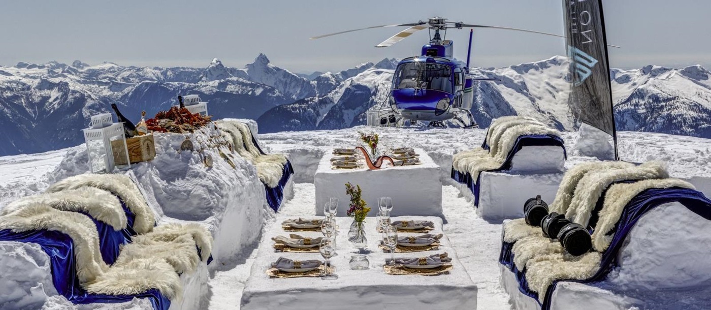 Meal in the snow on a helicopter tour at luxury private home The Belmont Estate in Whistler, Canada