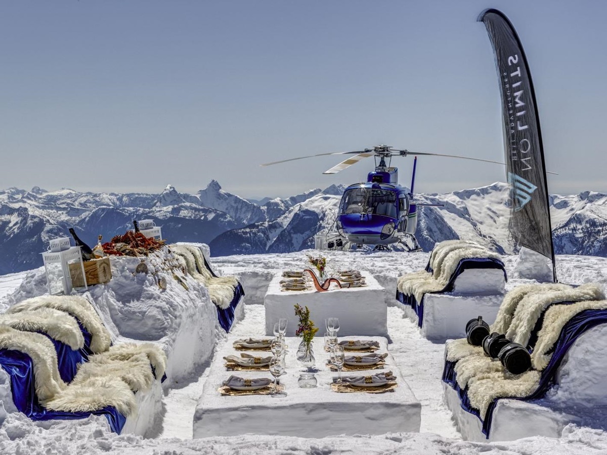 Meal in the snow on a helicopter tour at luxury private home The Belmont Estate in Whistler, Canada