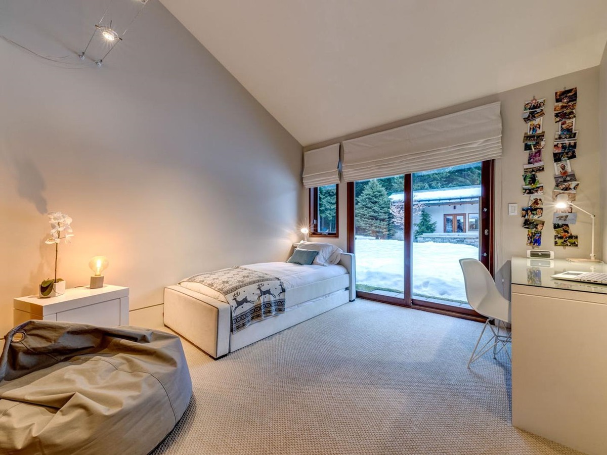 Single room with modern desk and direct access to the gardens at luxury private home The Belmont Estate in Whistler, Canada