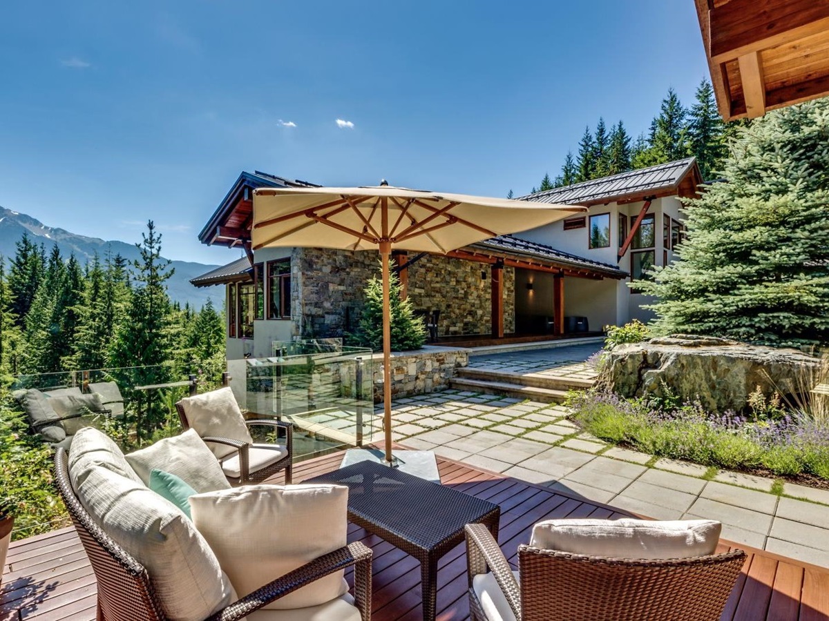 Small seating area on a terrace at luxury private home The Belmont Estate in Whistler, Canada