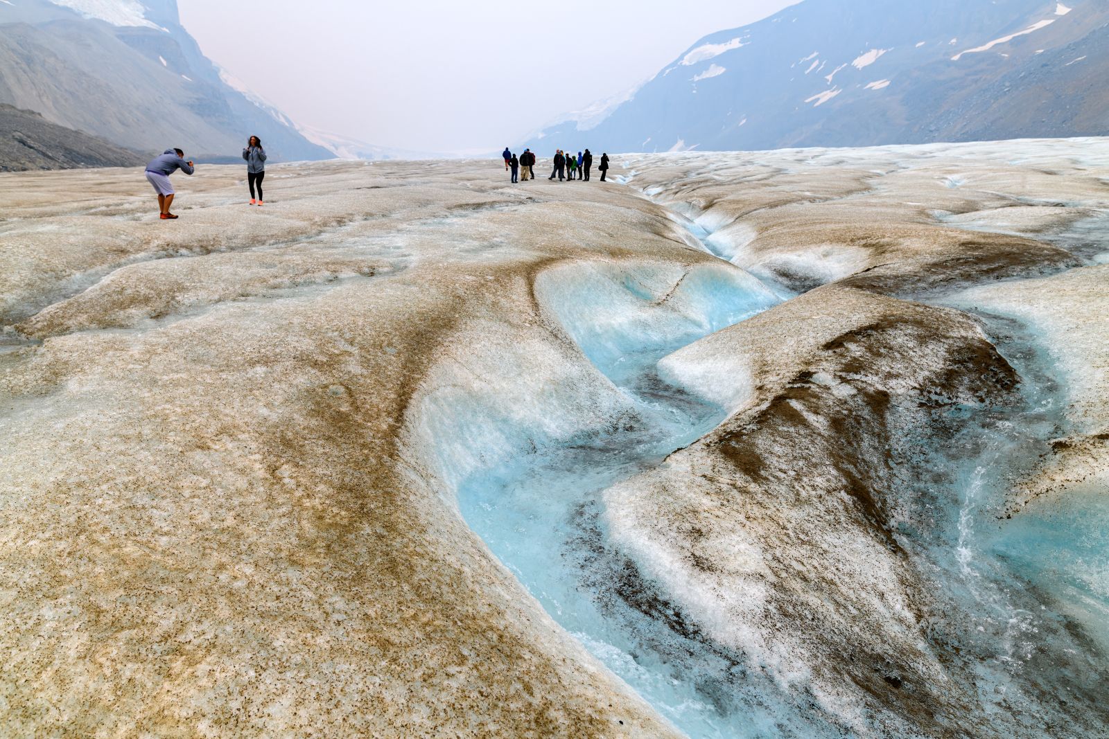 People trekking on the Columbia Icefield in Jasper, Canada