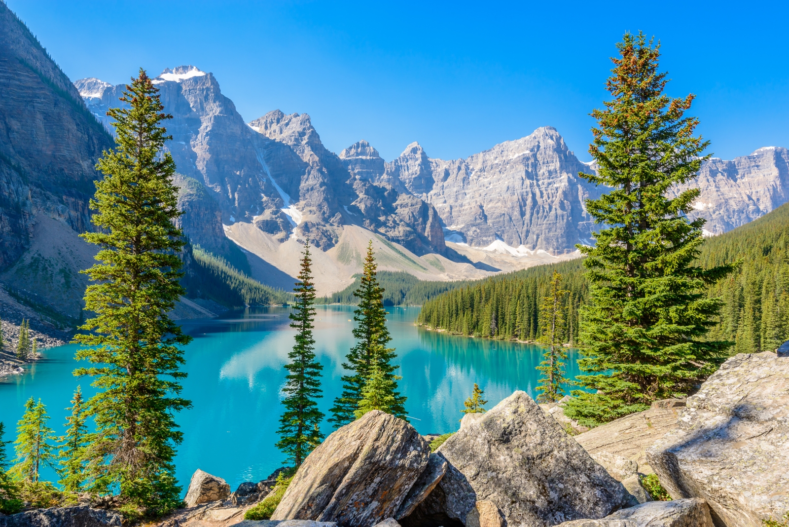 Large lake with mountain valley behind it