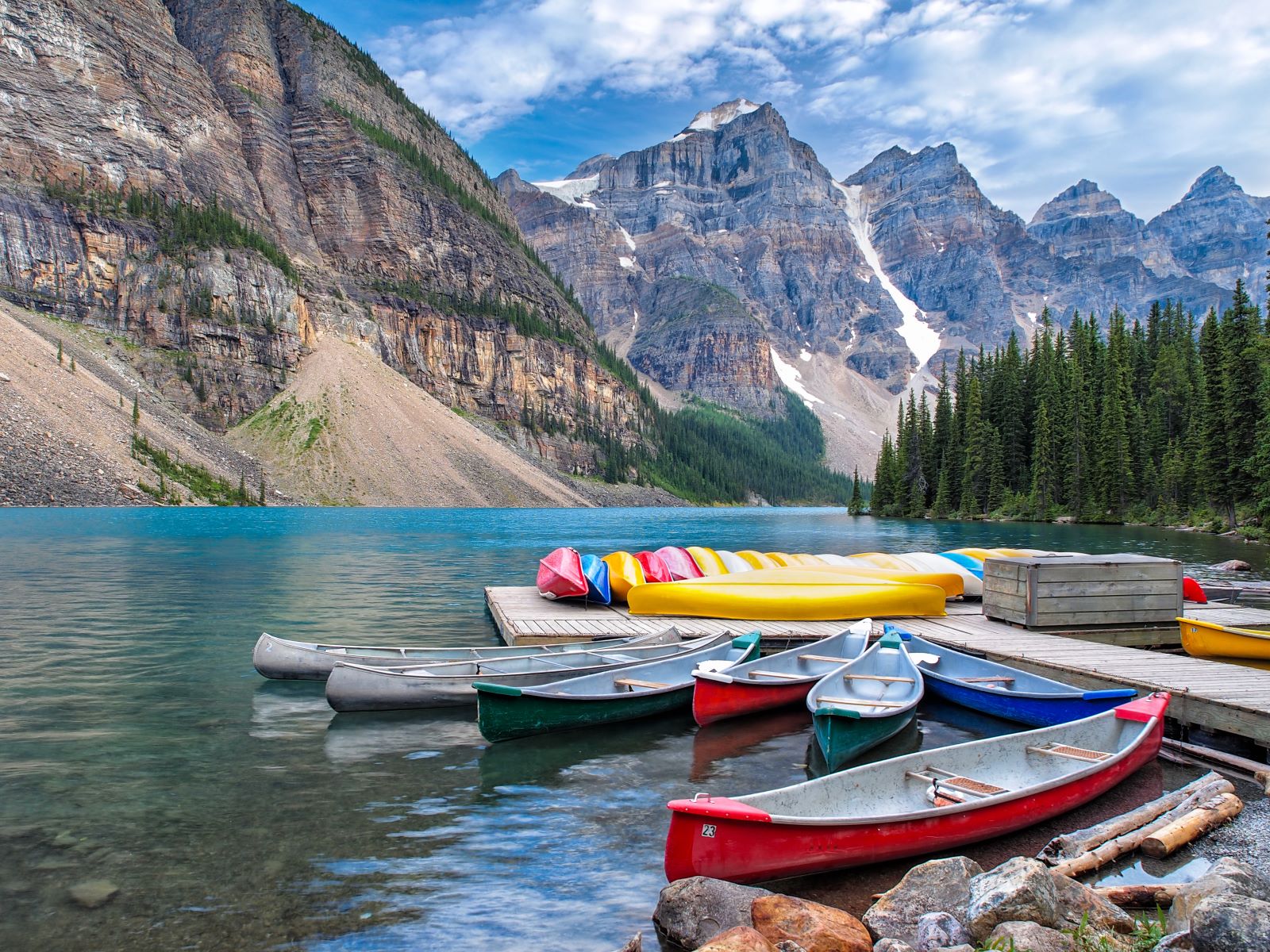 Boats on the banks of Moraine Lake in Banff National Park