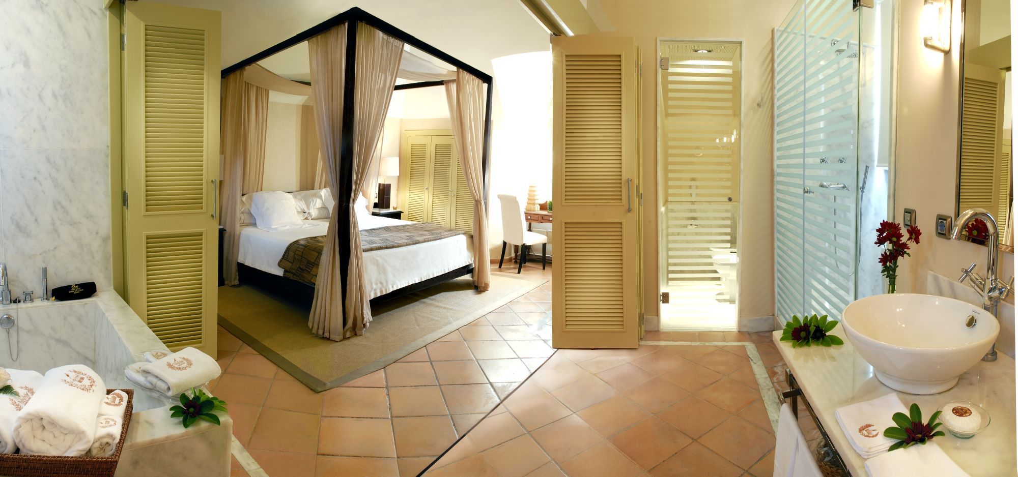 four poster bed in bedroom at bahia del duque in the canaries