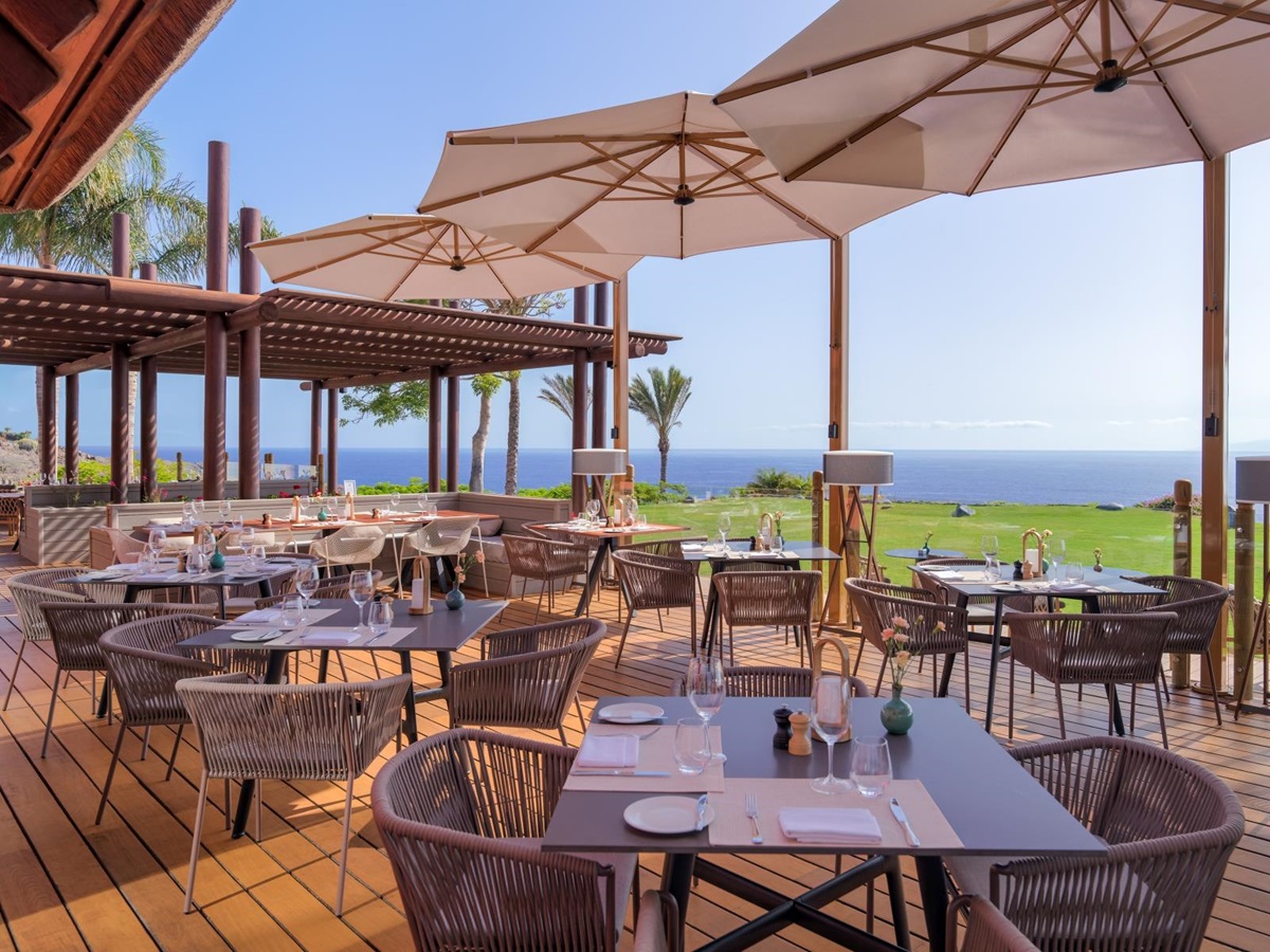 Terrace dining under parasols and with views over the Mediterranean Sea at El Mirador Restaurant at luxury resort Ritz Carlton Abama on Tenerife