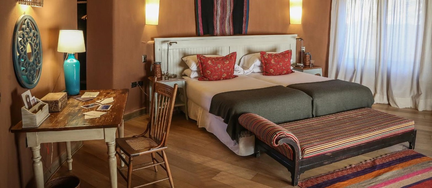 Guest suite double bedroom at Awasi Atacama in the Atacama Desert, Chile