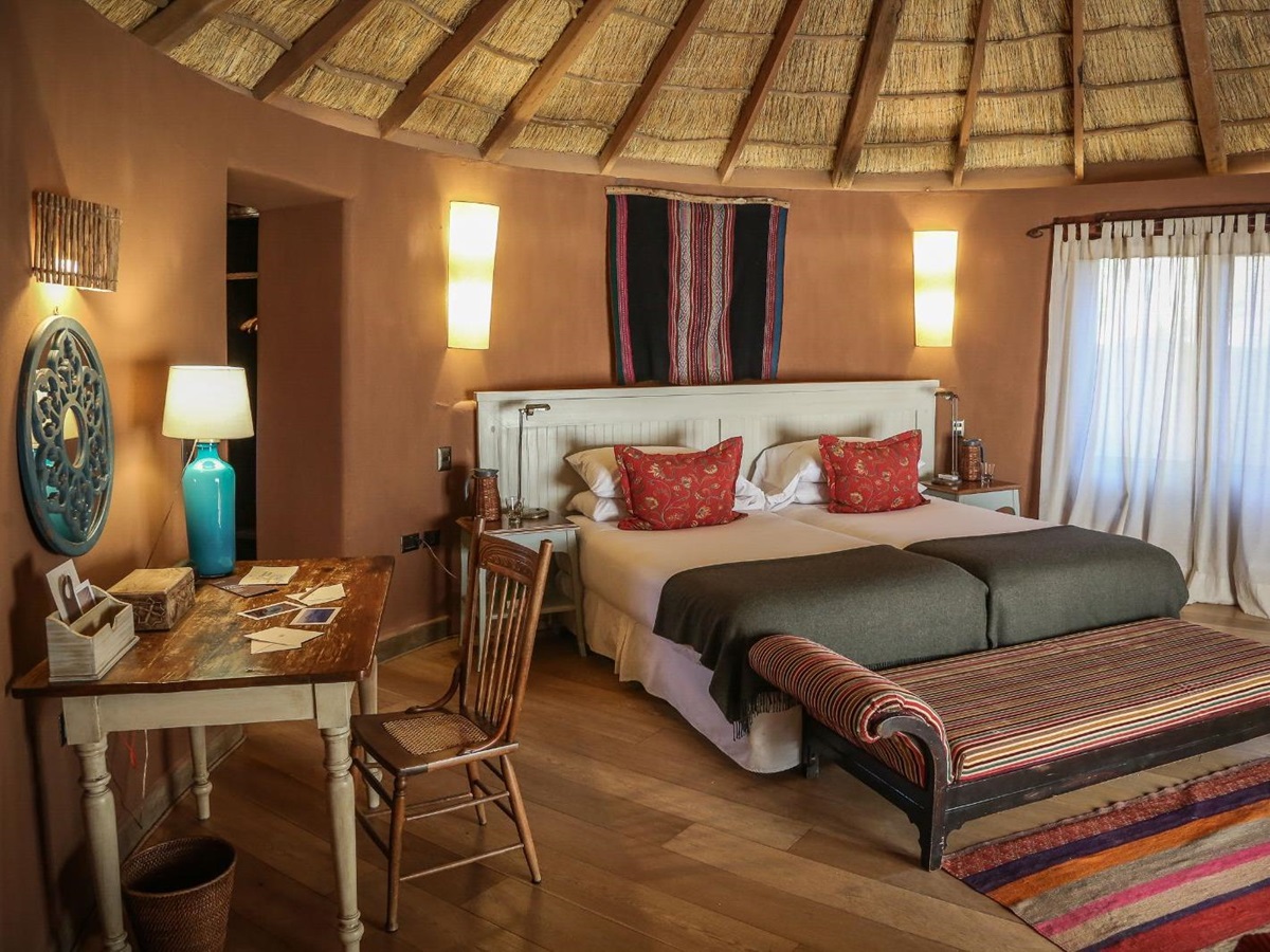 Guest suite double bedroom at Awasi Atacama in the Atacama Desert, Chile
