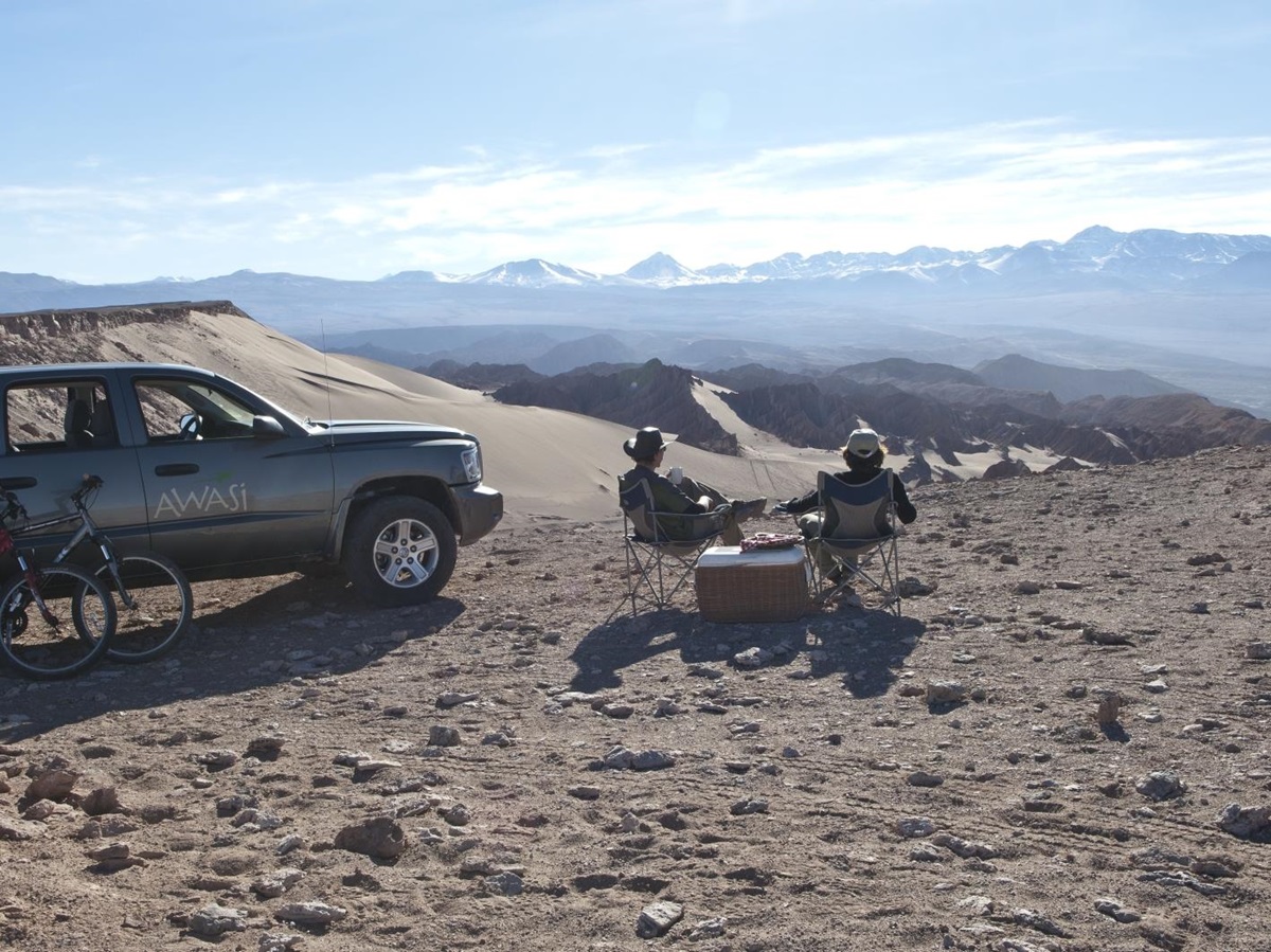 Two people enjoying the view of the mountainous desert