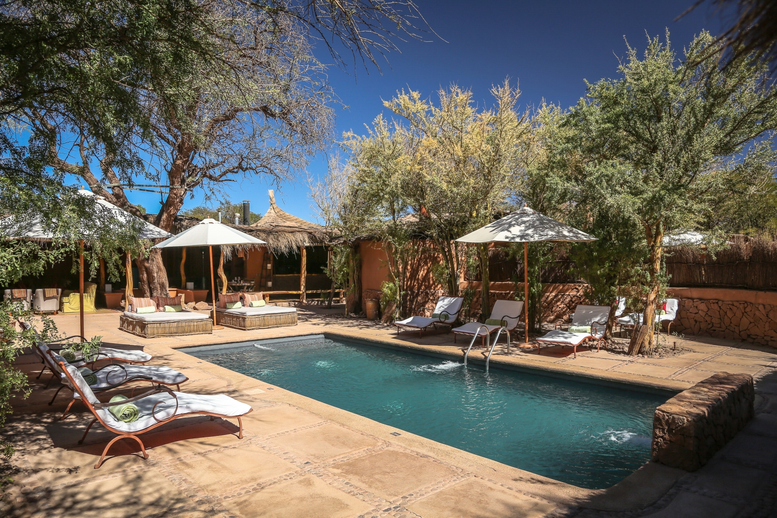 Pool and loungers at Awasi Atacama